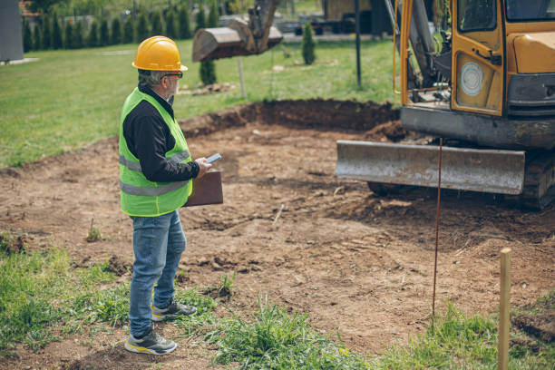 Retention pond construction contractor overseeing excavation process