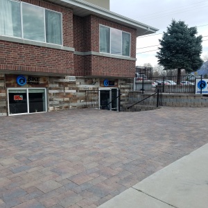 Belgard-pavers-Artstone-block-Buckskin-brown-and-natural-color-Wrought-Iron-railing-and-fence-stair-paver-entrance-Patio-seating-area-Tuscany-pavers-Lehi-pavers-Holland-wasatch-color-Telos-academy-T3-bike-shop-center-street-Orem-Utah